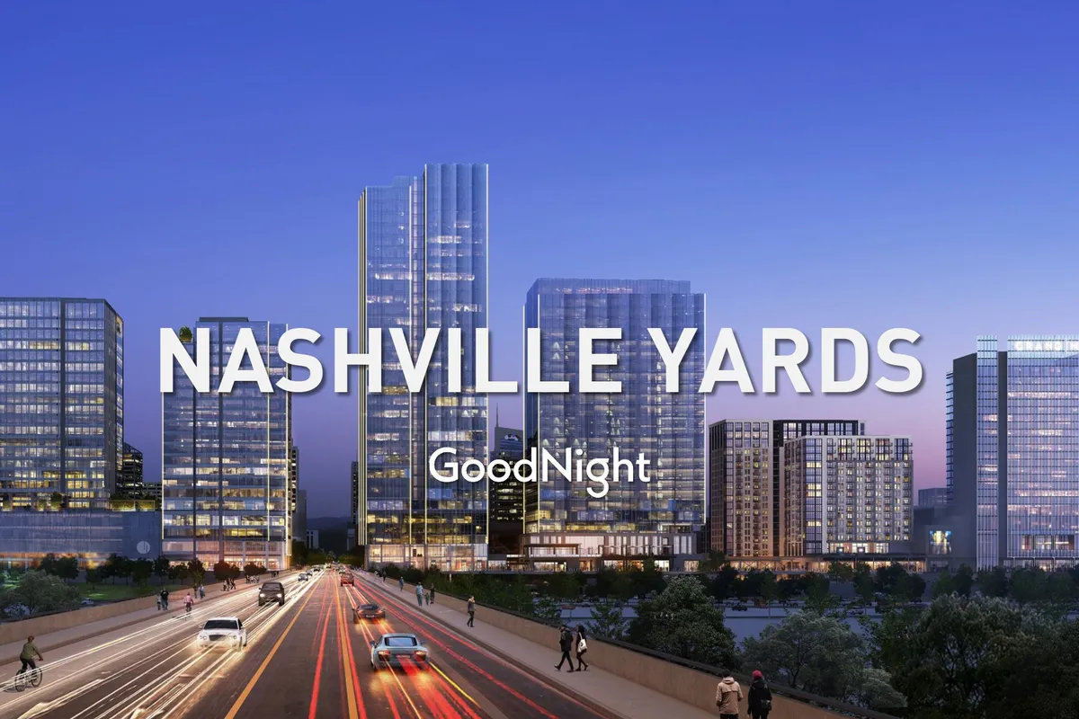 A dynamic cityscape with high-rise buildings and a bustling street below, capturing the energetic and sophisticated urban atmosphere of East Nashville. The skyline underlines the neighborhood’s proximity to city life and vibrant dining and nightlife scenes.